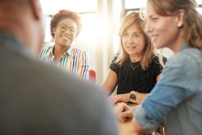 people talking at a table.