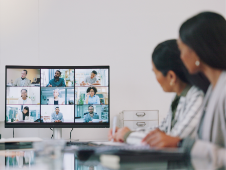 Physicians participating in an education session by computer